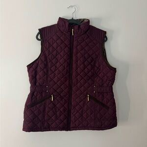 Weather proof burgundy puffer vest with gold hardware and fleece lining